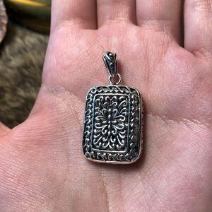 Vintage reversible hollow sterling silver open work scroll pendant